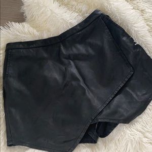 Asymmetric black shorts leather